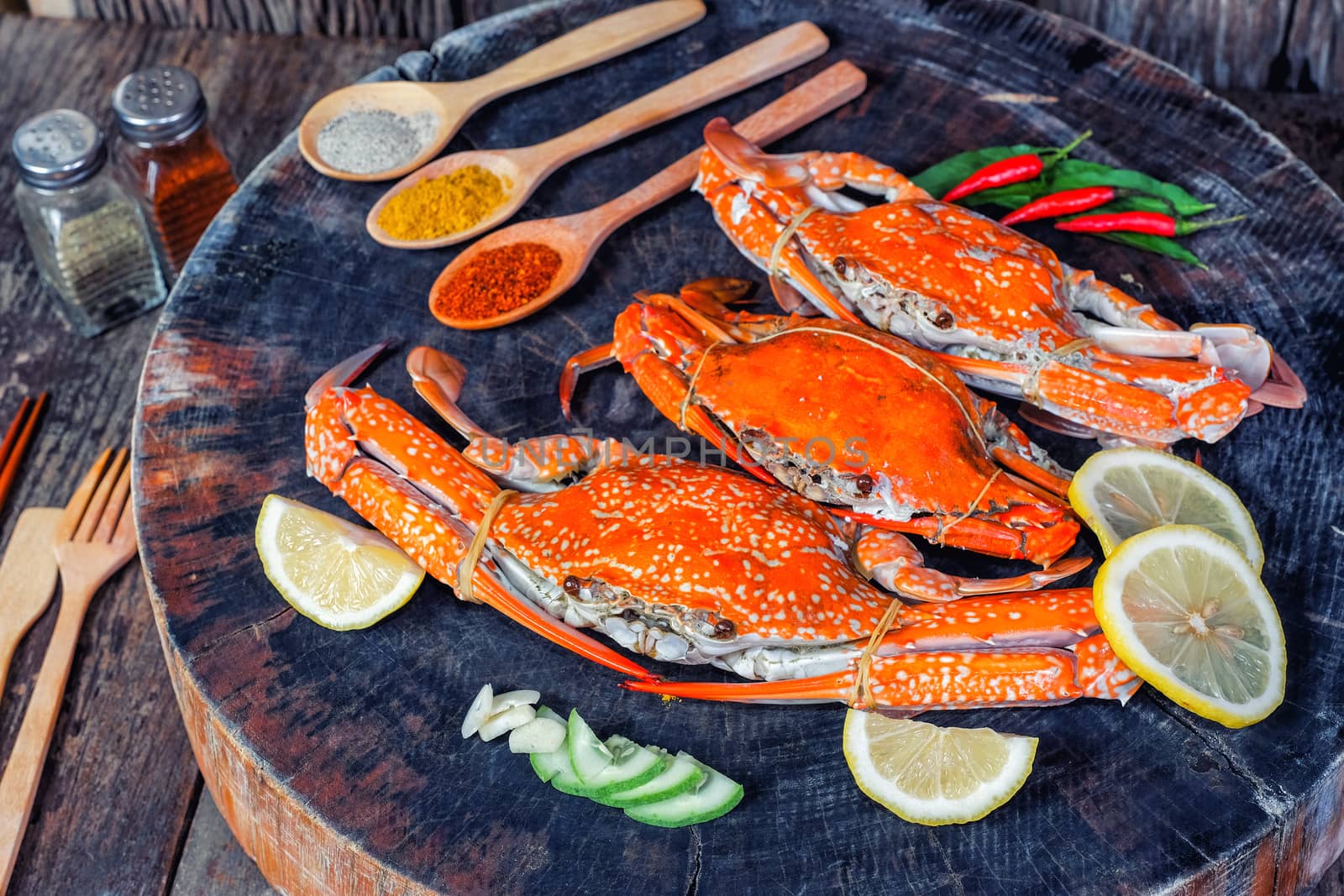 jumbo crab and spices herb on dark background 