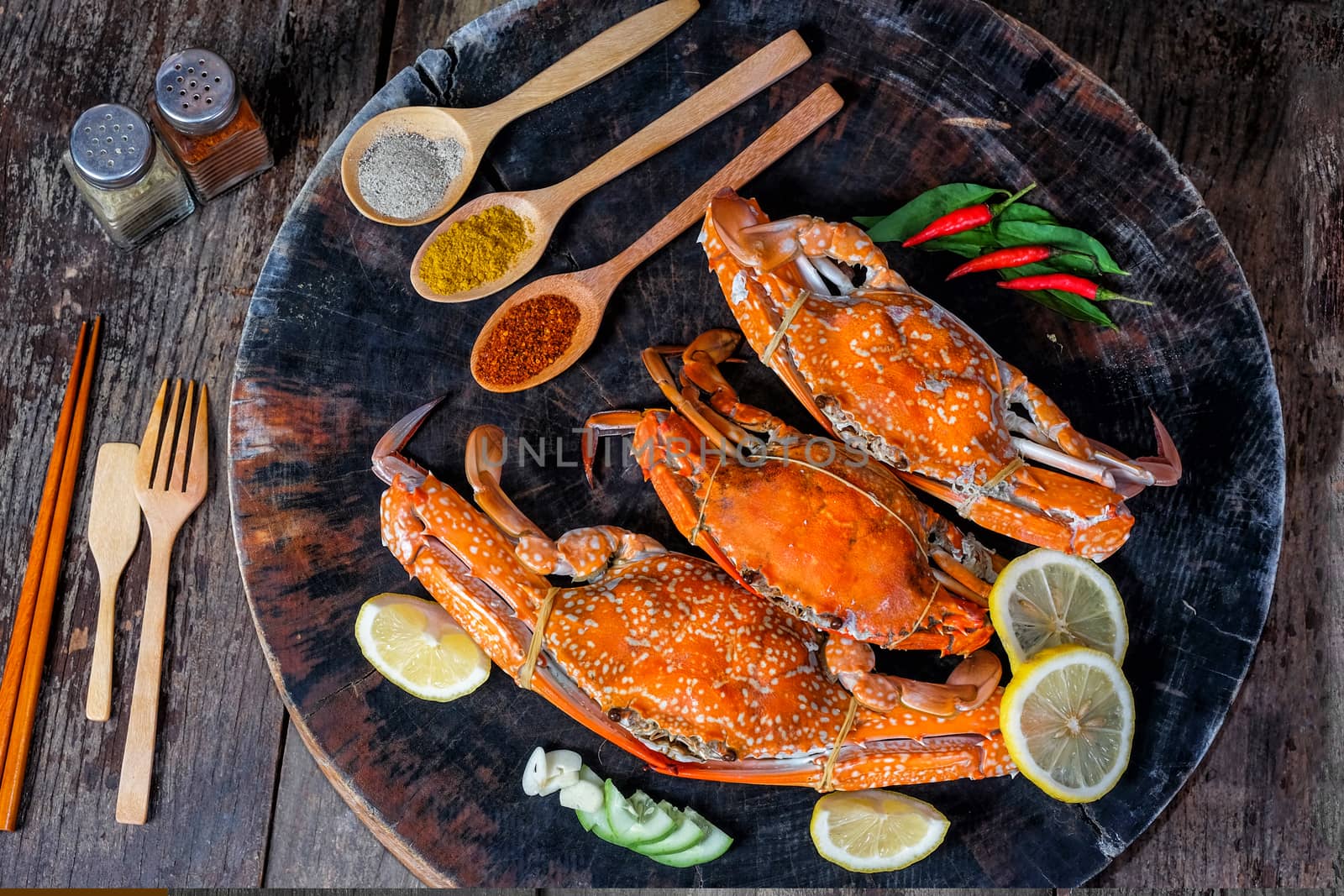 jumbo crab and spices herb on dark background