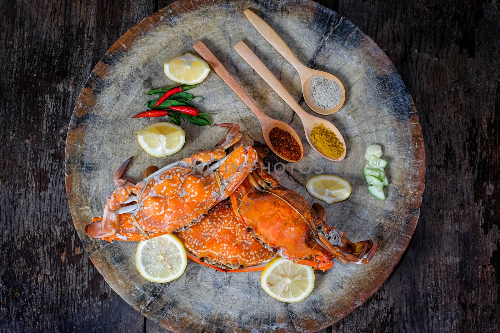 jumbo crab and spices herb on dark background

