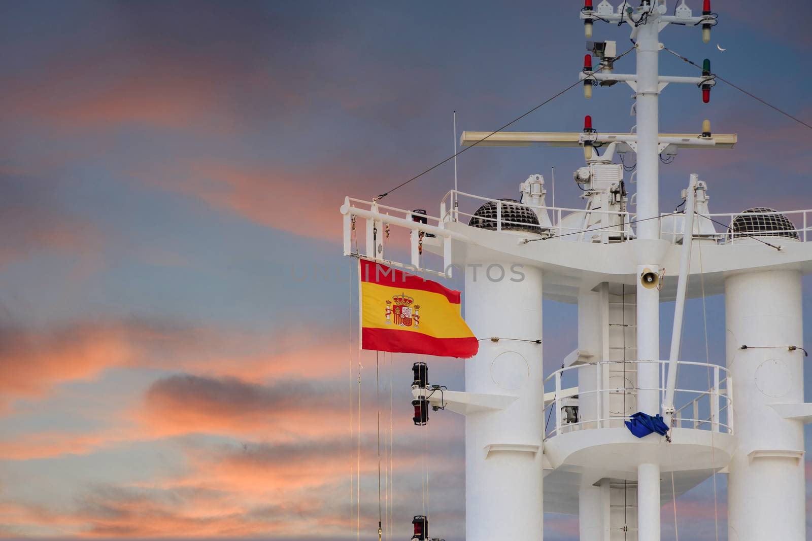 Spanish Flag on Ships Tower at Dusk by dbvirago