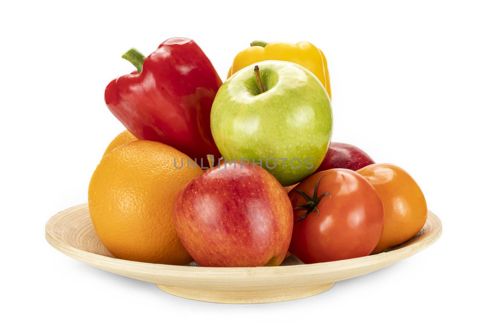 Plate of fresh ripe oranges, red, and green apples, persimmon, red and yellow bell peppers isolated on a white background.