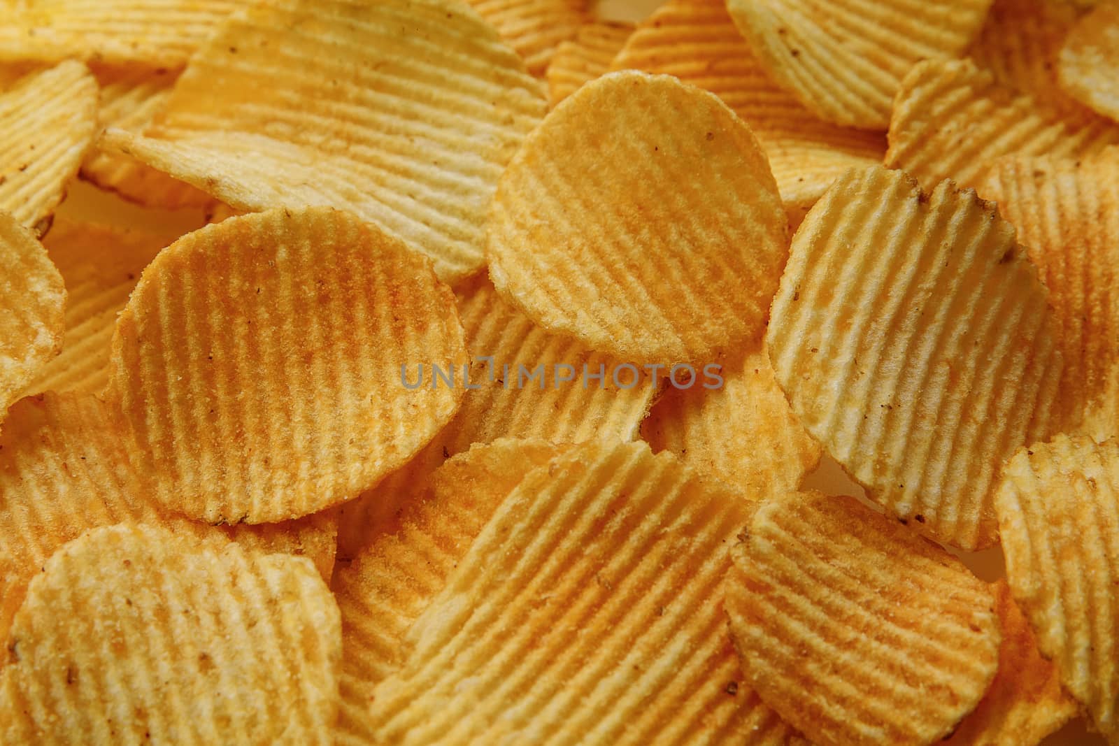 Corrugated Potato Chips. Food background. Top view. by 9parusnikov