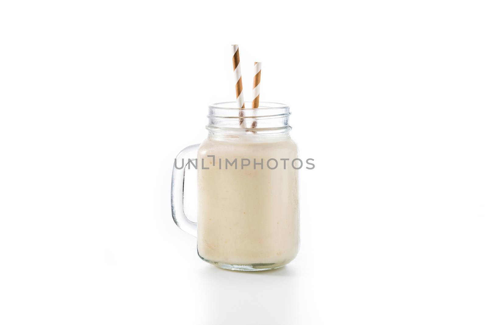 Banana smoothie with almond in jar  by chandlervid85