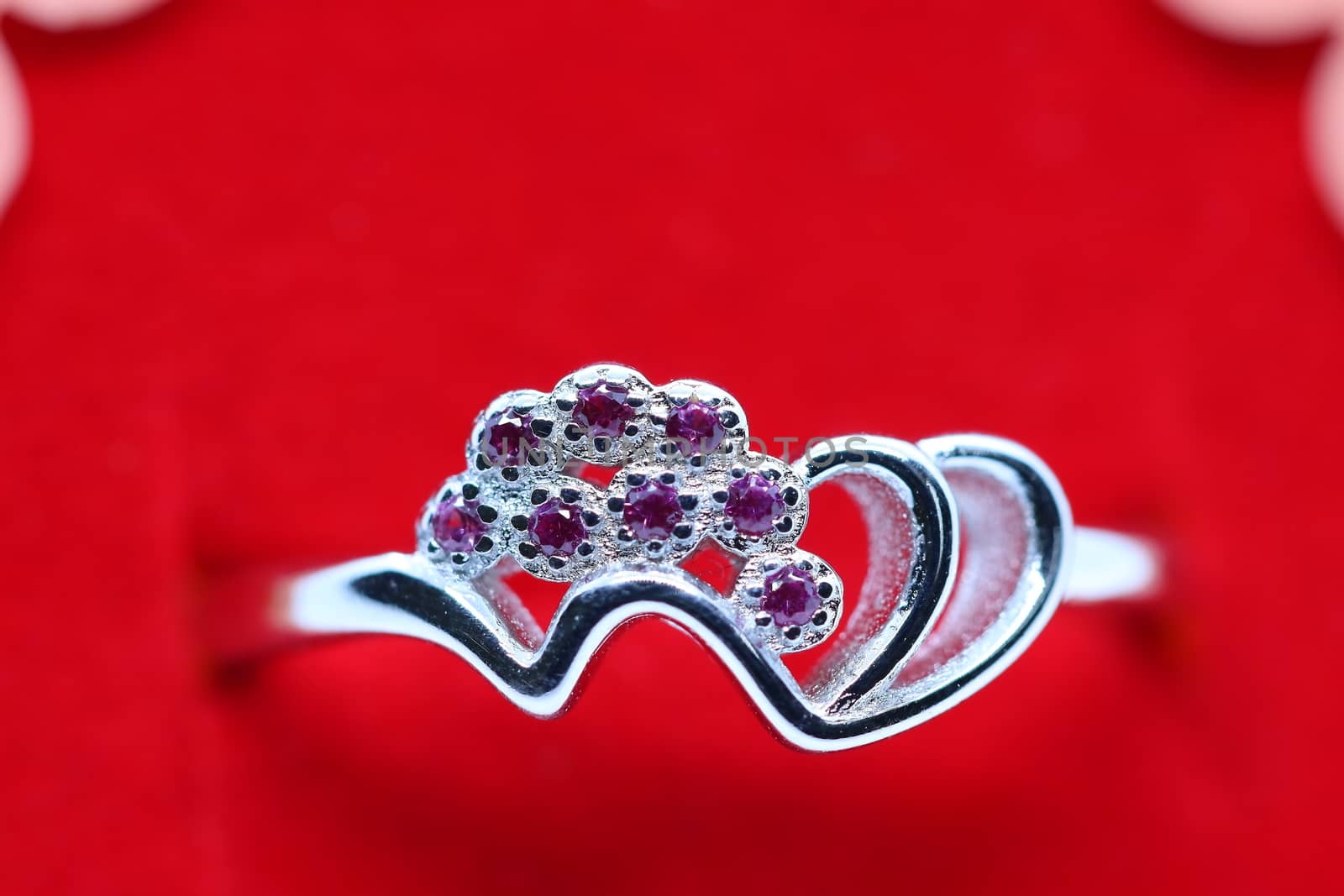 silver ring with pink stone with isolated background