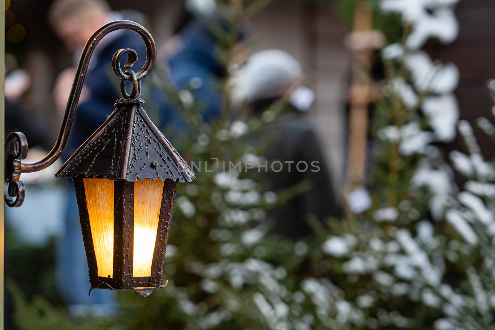 Medieval lanterns with spruce branches at Christmas market. Riga, Latvia - image