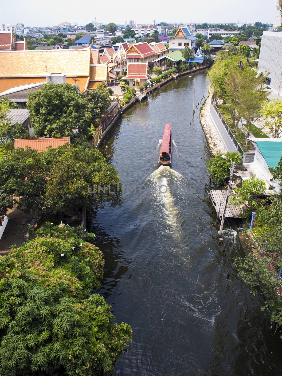 Boat in canal by Satakorn