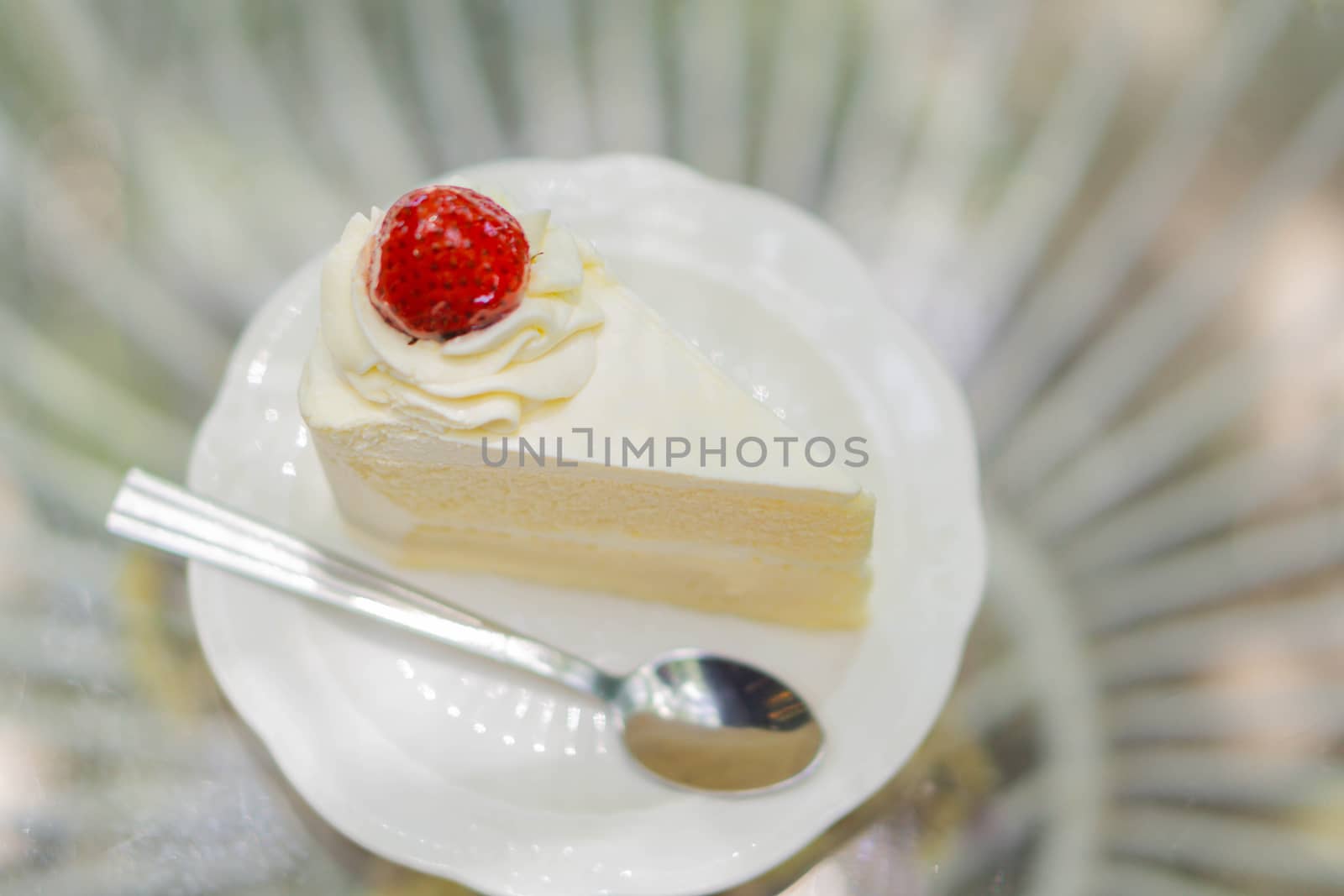 Closeup Milk cake delicious on glass table background, selective focus