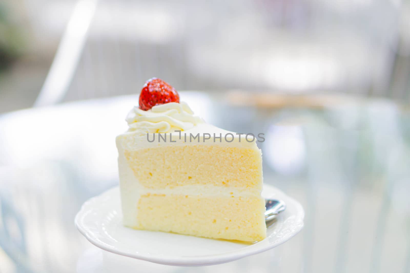 Closeup Milk cake delicious on glass table background, selective focus