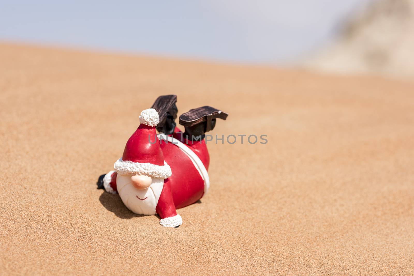 Santa Claus in the desert of sand  enjoying his time