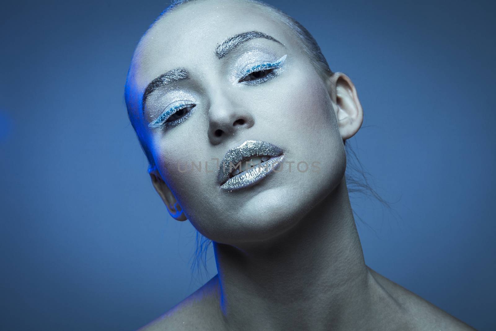 Portraits of a young fashion model as ice queen.