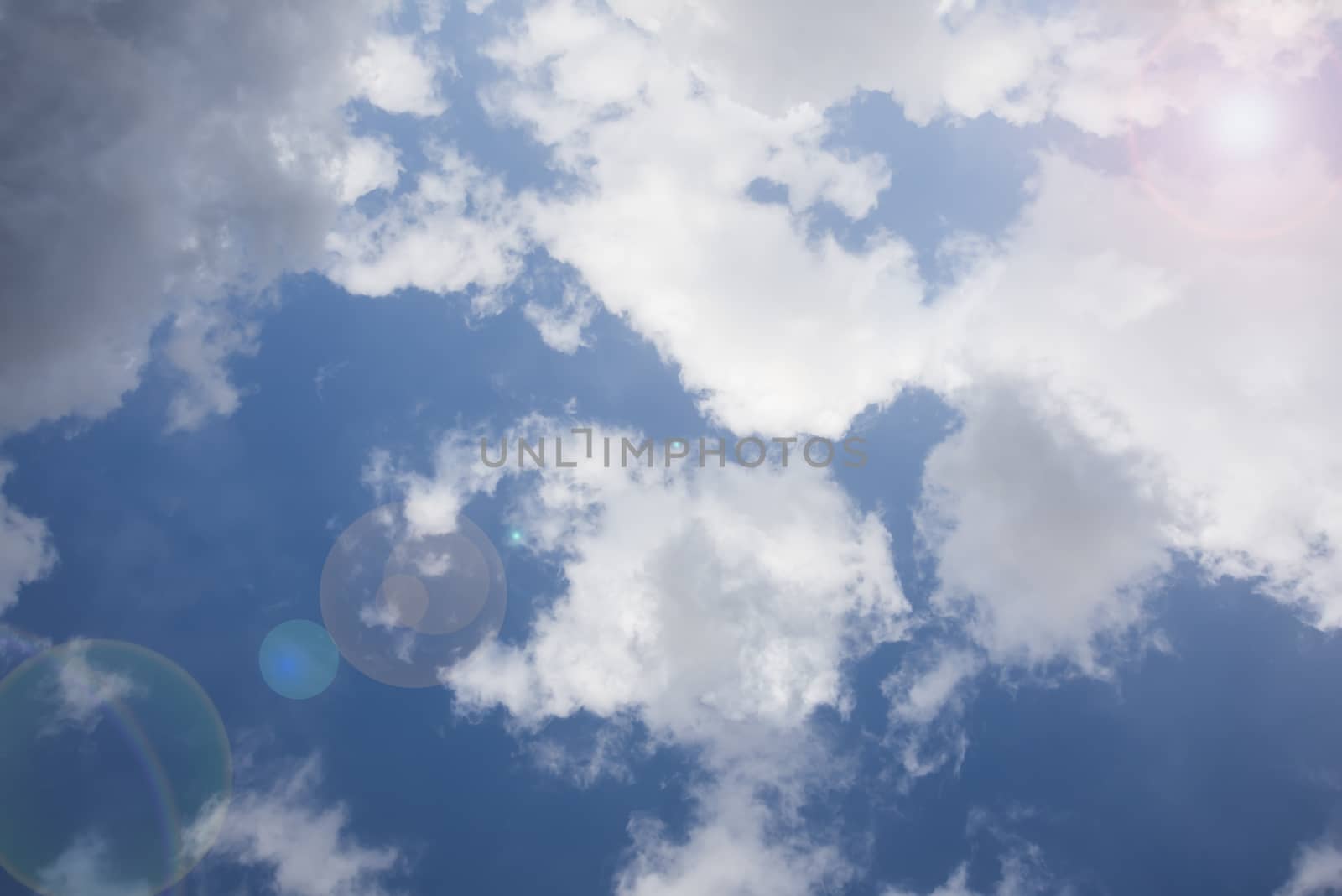 Blue sky with white clouds and sun by GABIS