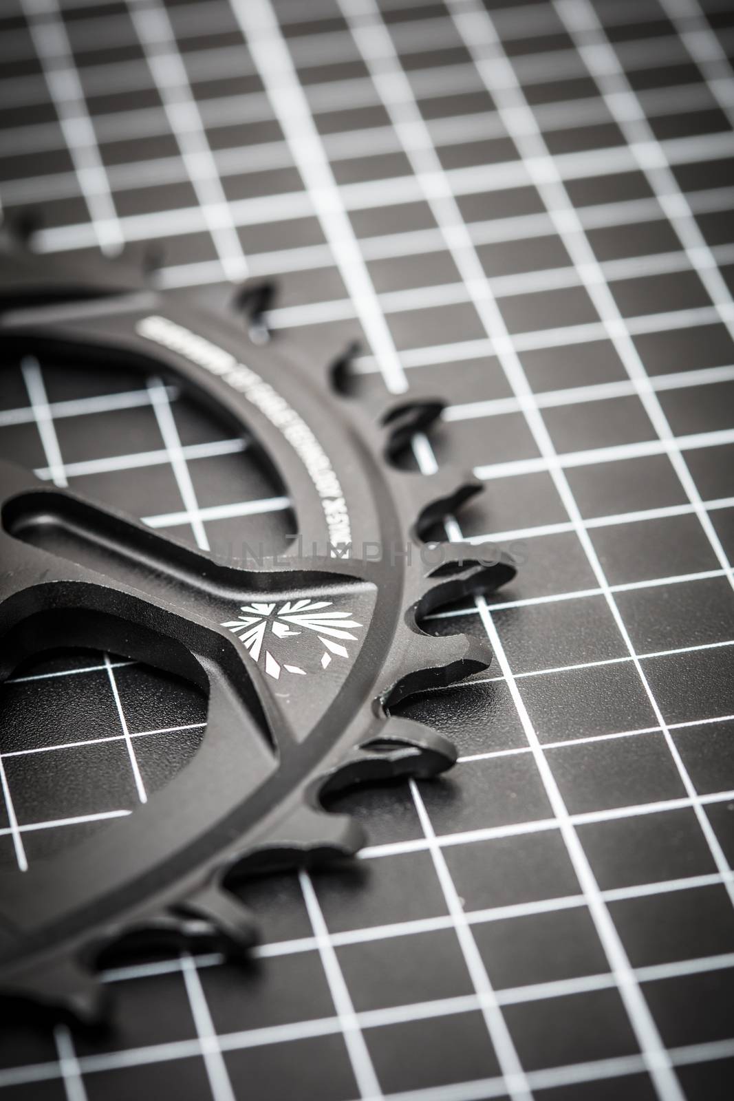 A bicycle front chainring ready to be installed onto a mountain bike