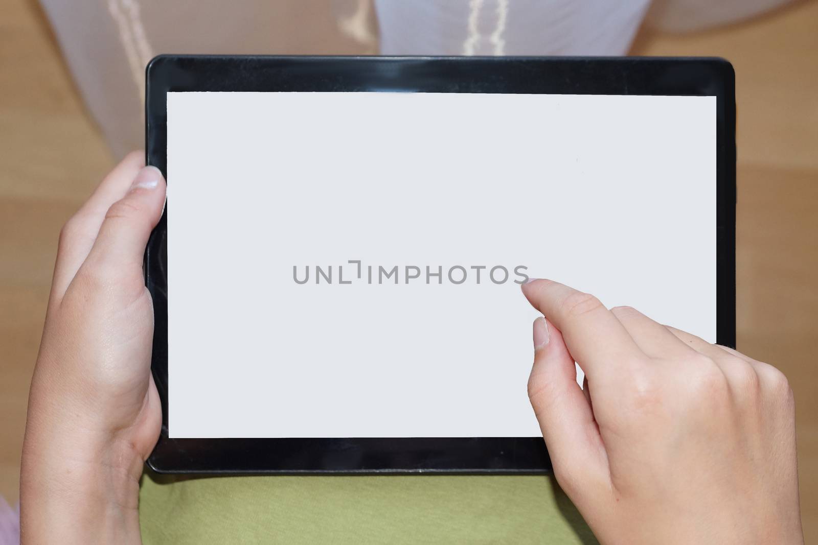 tablet with white screen in female hands, mock up