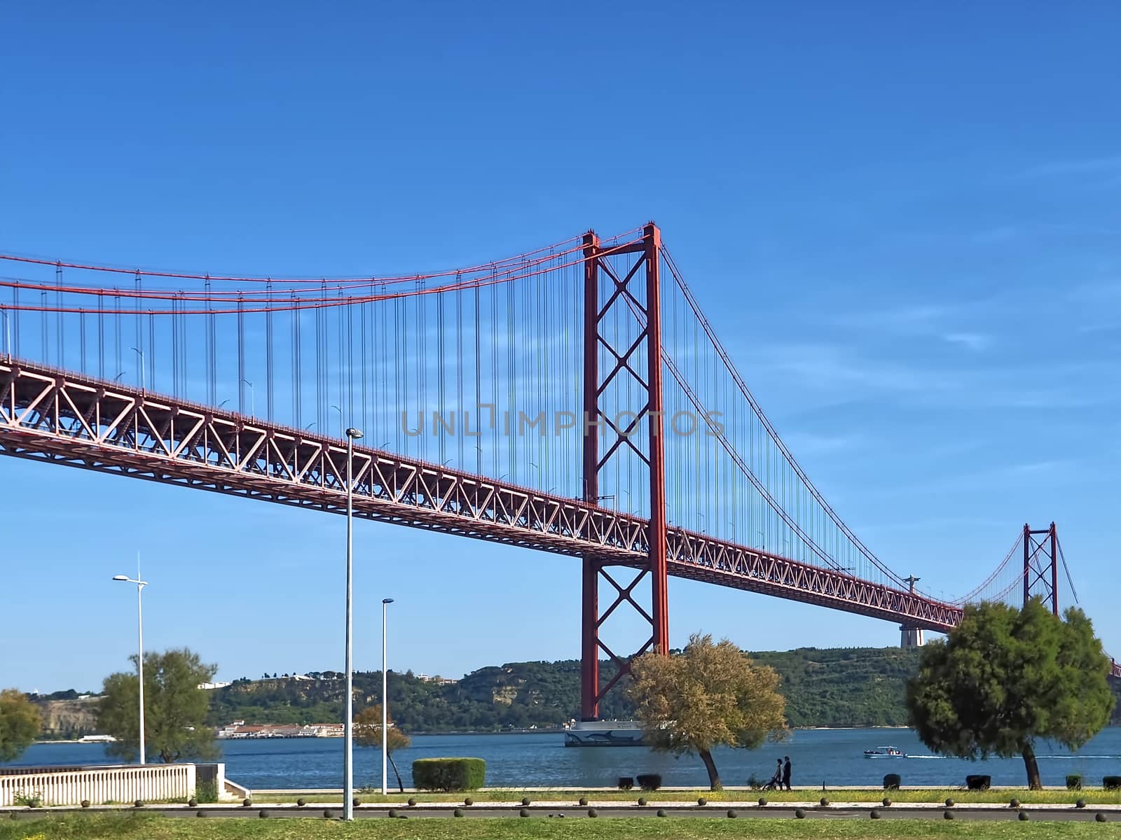 Seagull flying over red bridge ponte 25 de abril by Stimmungsbilder