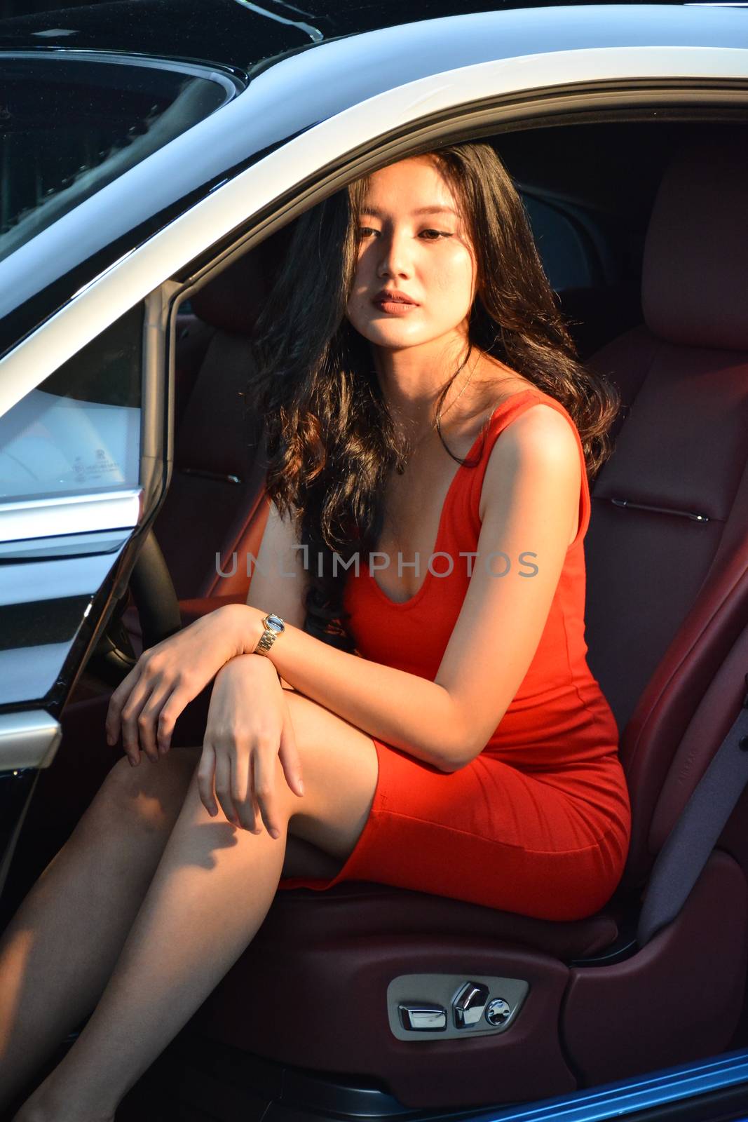 TAGUIG, PH - JULY 13 - Rolls Royce female model at Rolls Royce car showroom on July 13, 2019 in Bonifacio Global City, Taguig, Philippines.