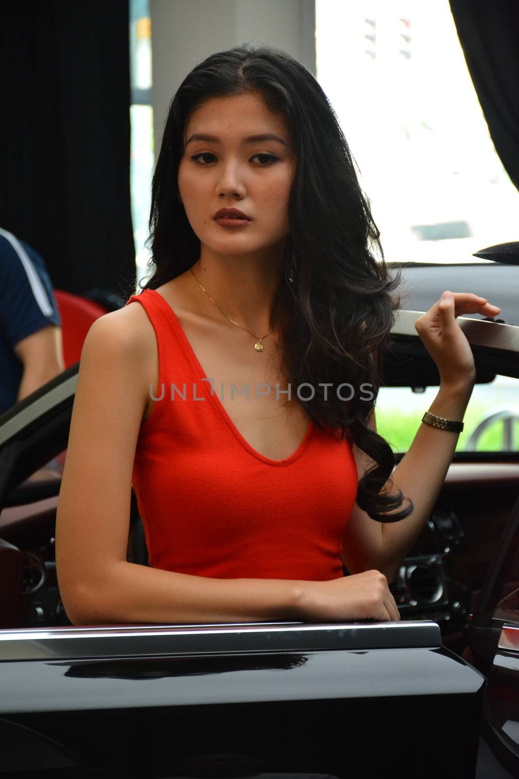 TAGUIG, PH - JULY 13 - Rolls Royce female model at Rolls Royce car showroom on July 13, 2019 in Bonifacio Global City, Taguig, Philippines.
