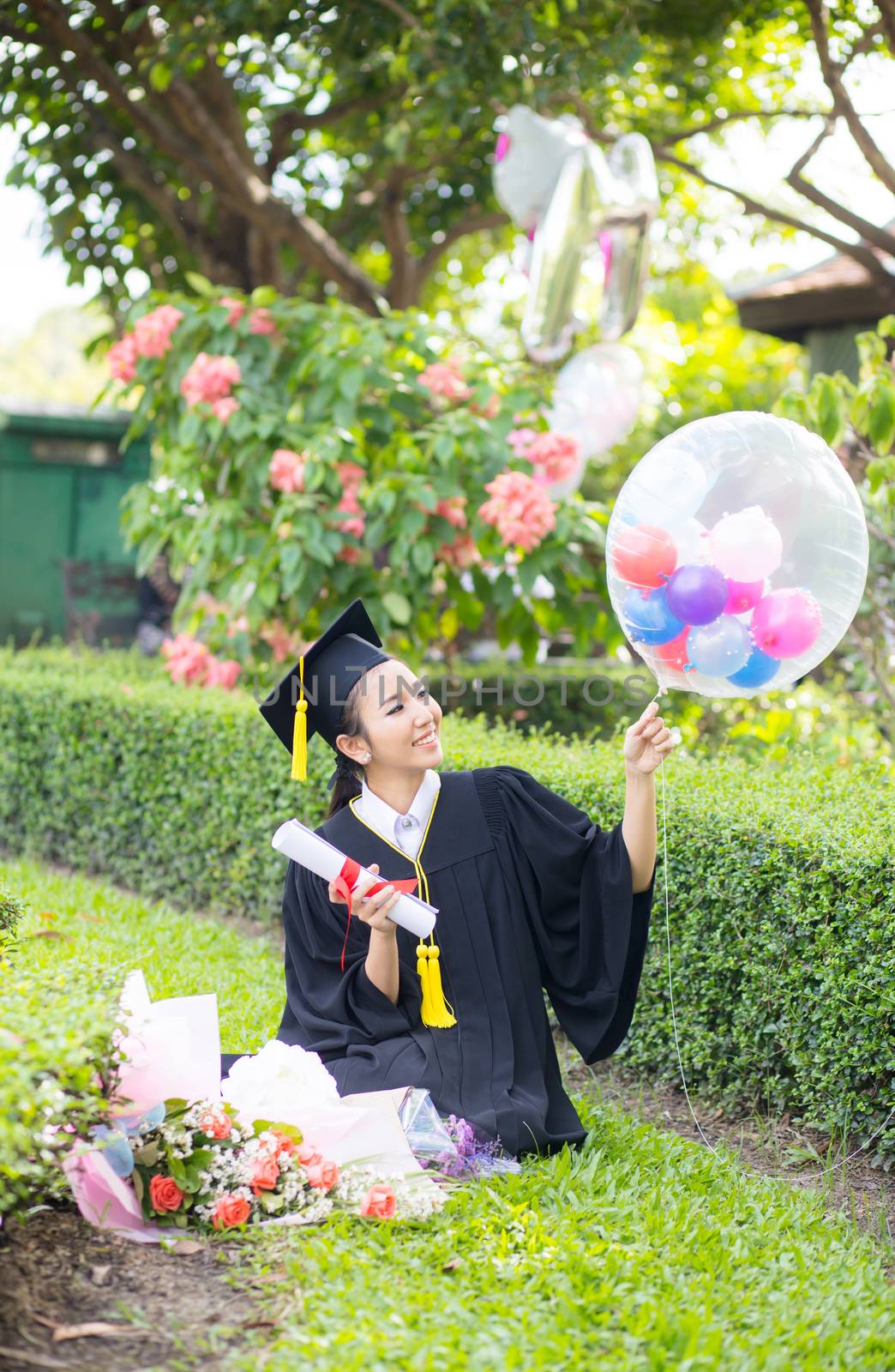 Happy graduated student girl - congratulations of education success.