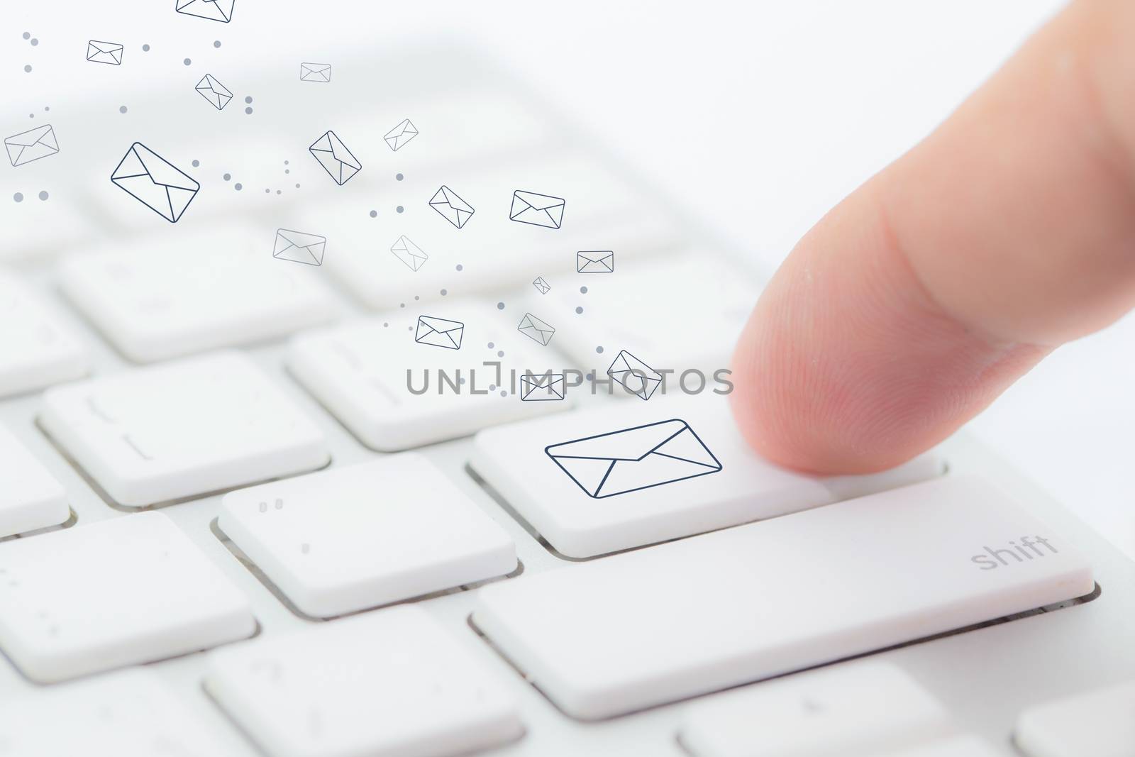 Sending email. gesture of finger pressing send button on a computer keyboard.