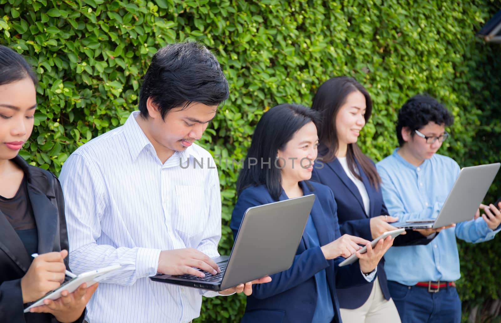 Business People Meeting Corporate Digital Device Connection Concept on tree wall.