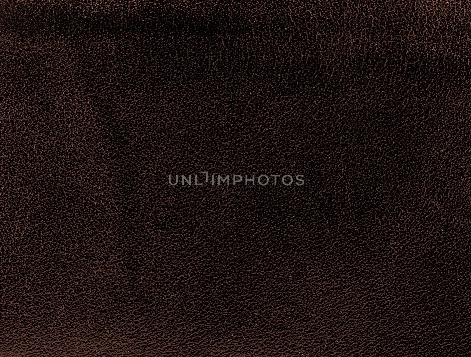 Brown leather texture closeup. Useful as background for design-works.