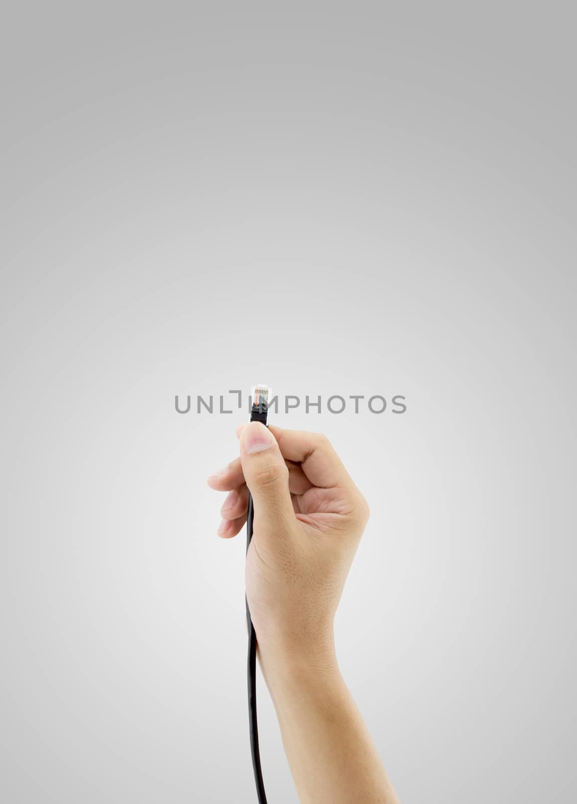 A LAN connector in hand on white background.