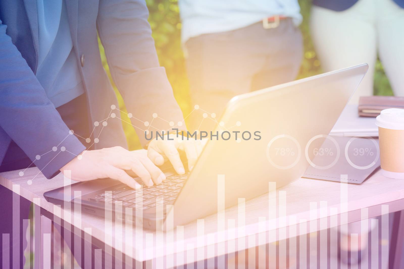 Business economic and technology working concept. Woman hand using notebook double exposure graph money stock trading finance concept.