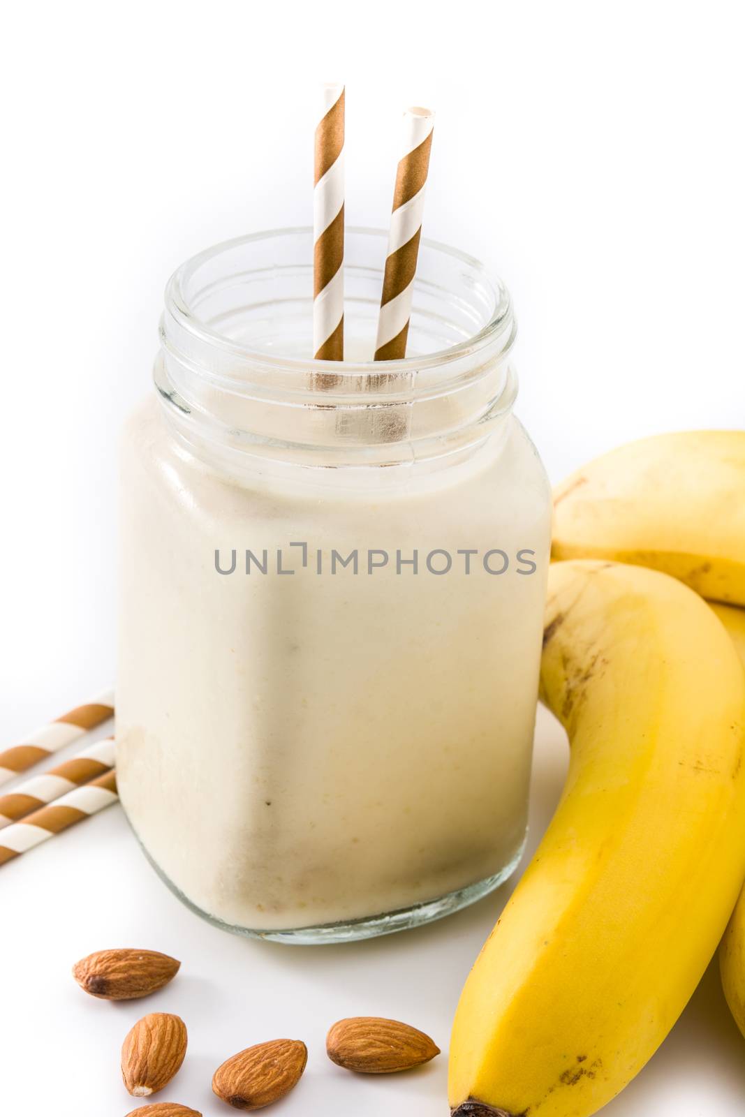 Banana smoothie with almond in jar  by chandlervid85