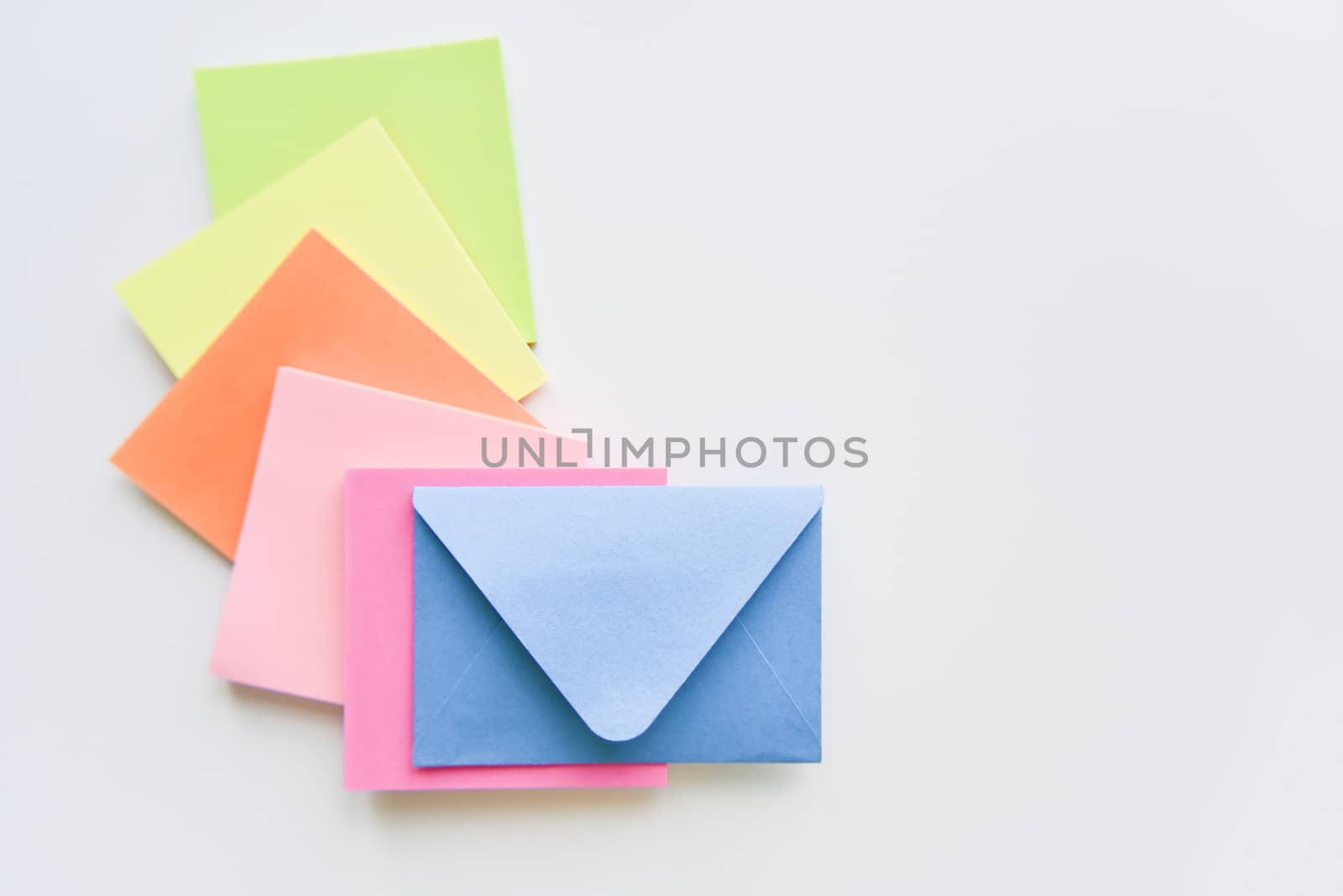selective focus, blue envelope in the center with bright colored rectangles spreading under it