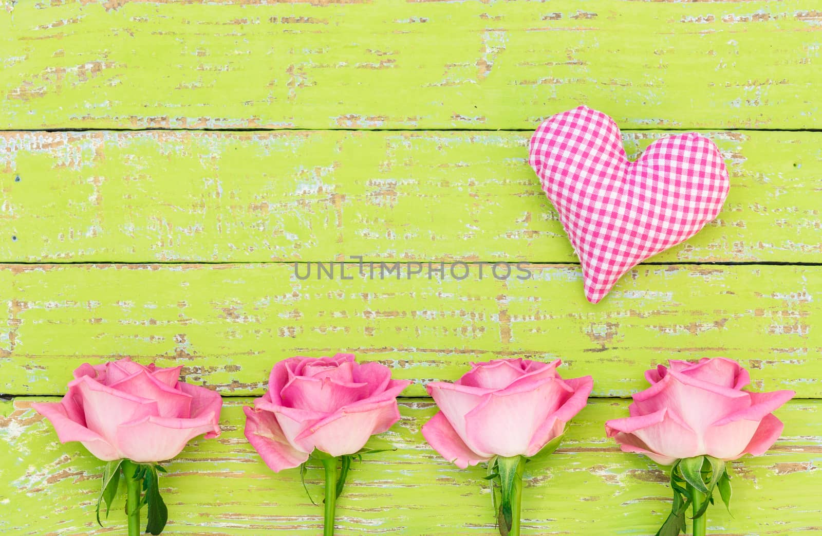 Romantic rose flowers with pink heart on wooden background by Vulcano