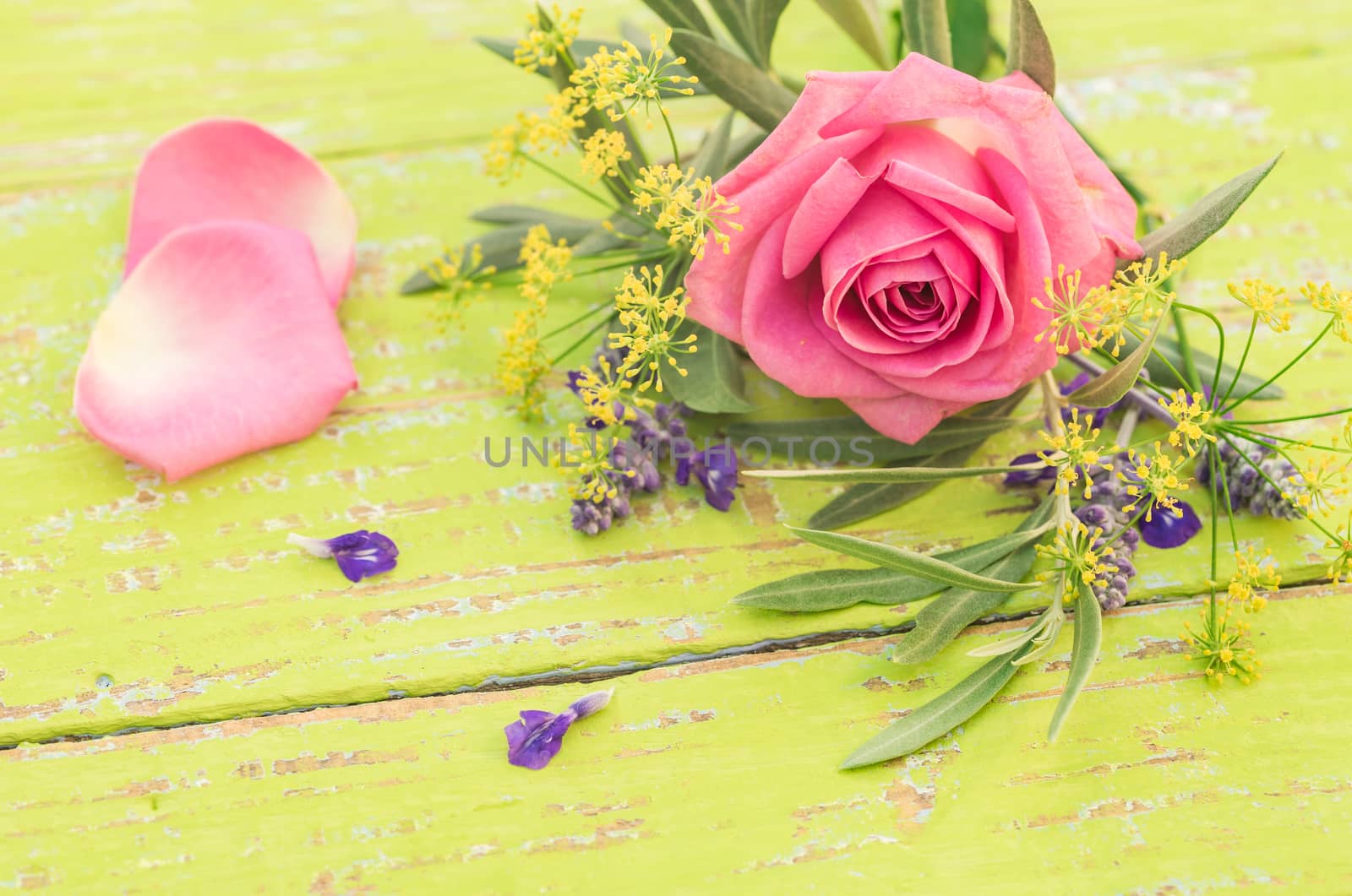 Bunch of beautiful flowers with pink rose on yellow wood by Vulcano