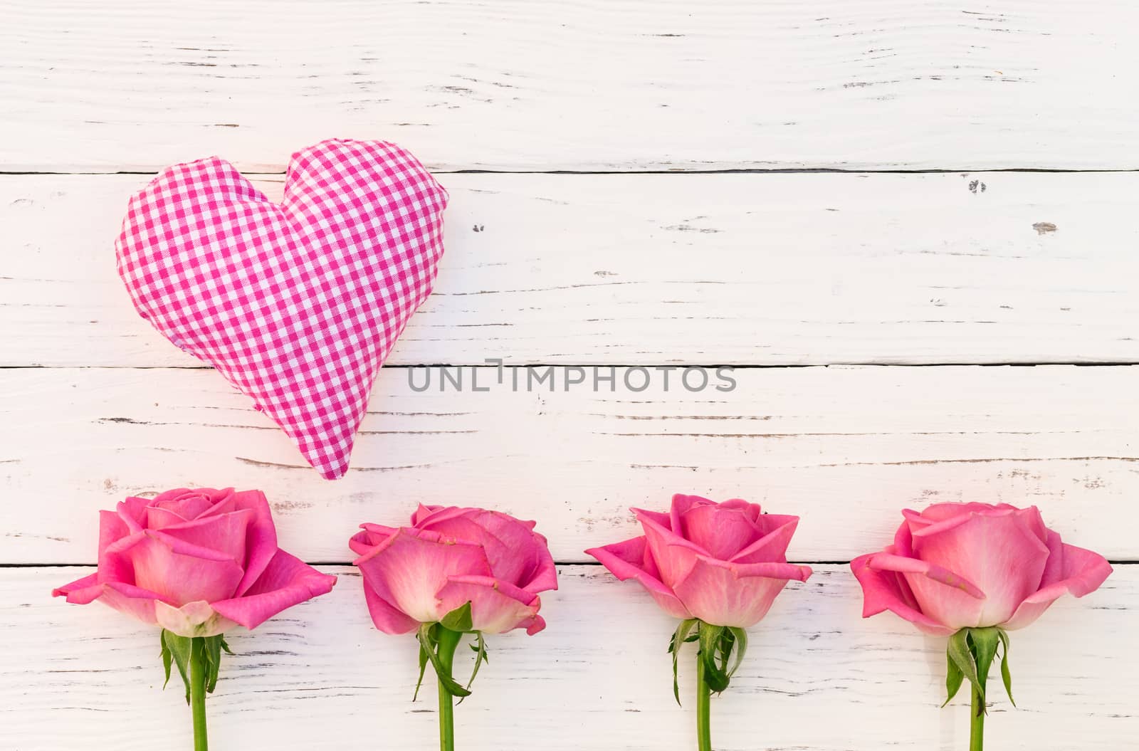 Valentines day background with pink heart and roses on white wood by Vulcano