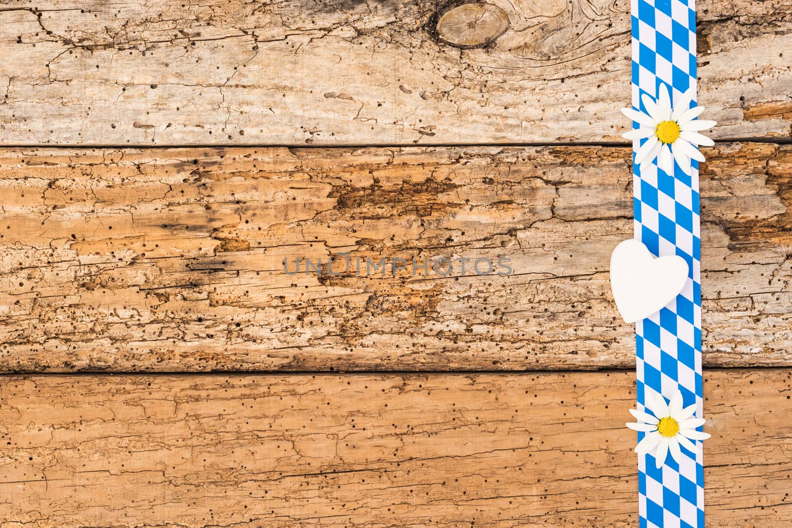Oktoberfest background with old wooden planks and traditional blue white pattern