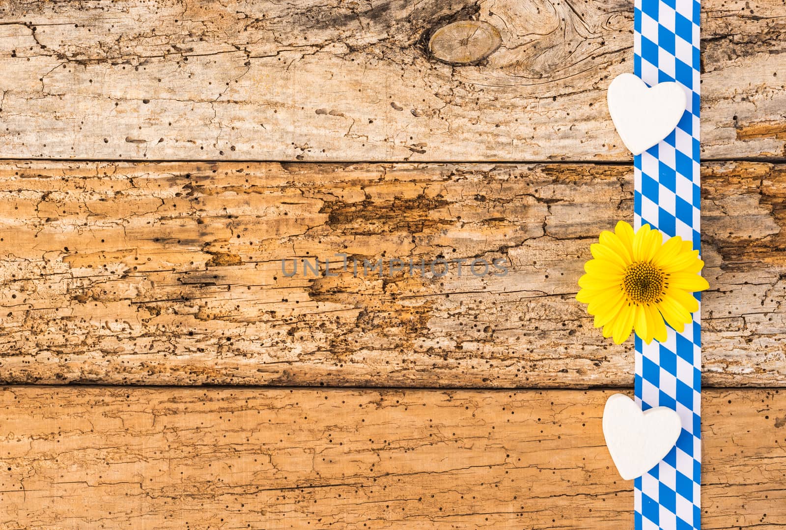 Rustic background for Oktoberfest Germany with bavarian pattern, hearts and flower