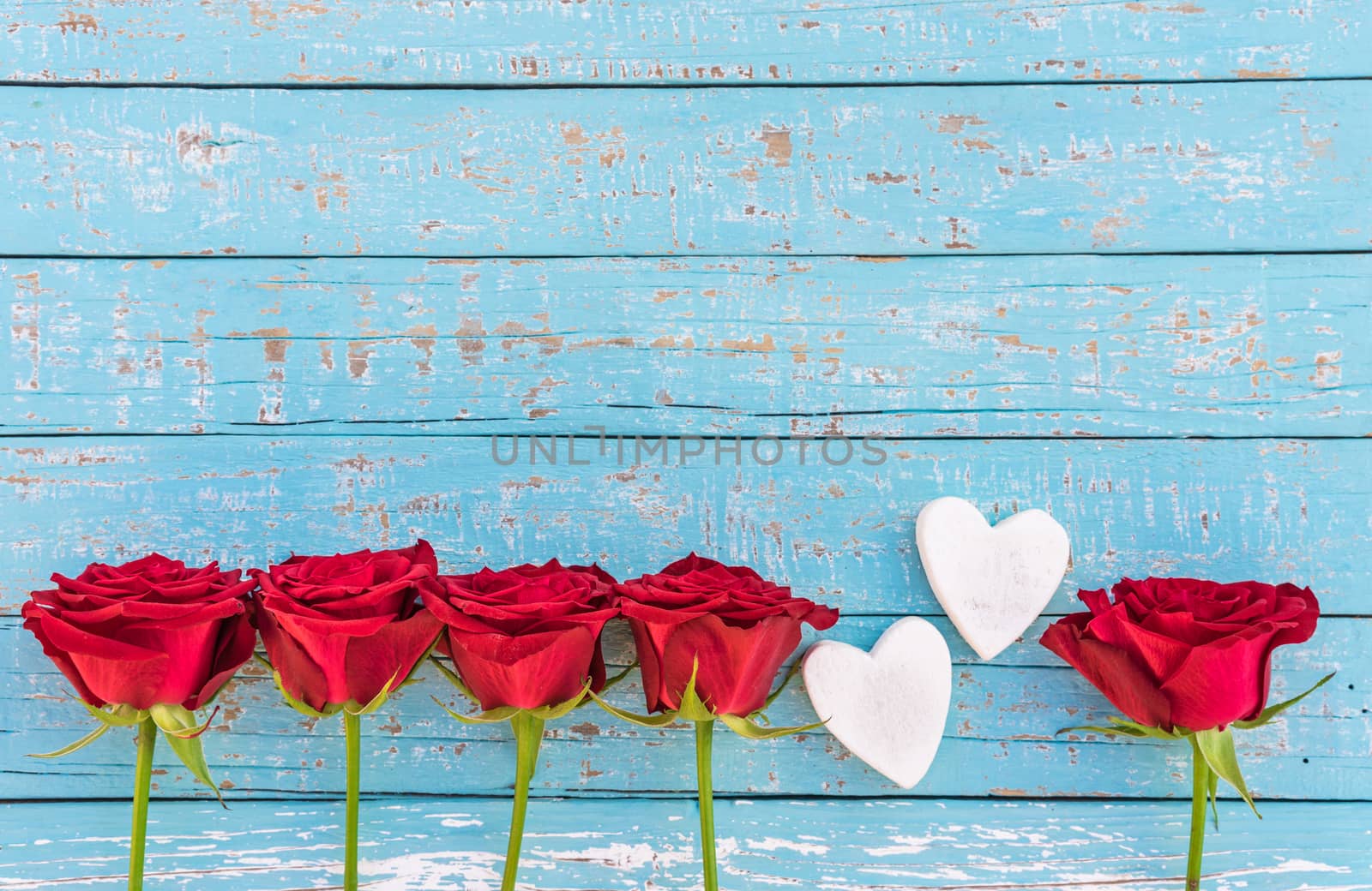 Valentines day background with red roses and two hearts by Vulcano