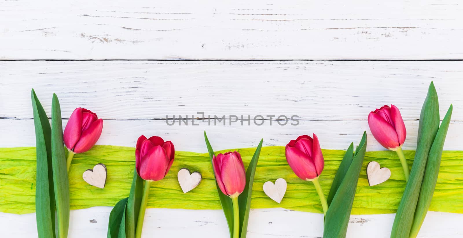 Red flowers and hearts border for Valentine day background with copy space