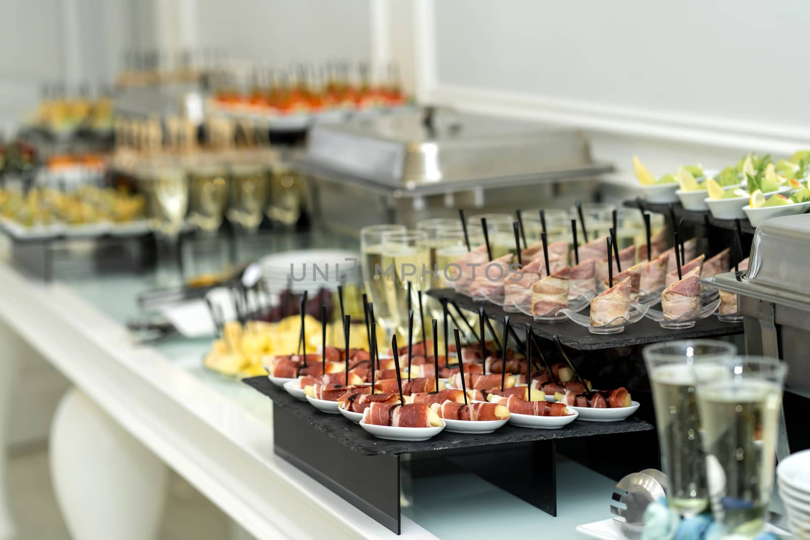 Festive buffet table with many snacks and appetizers.