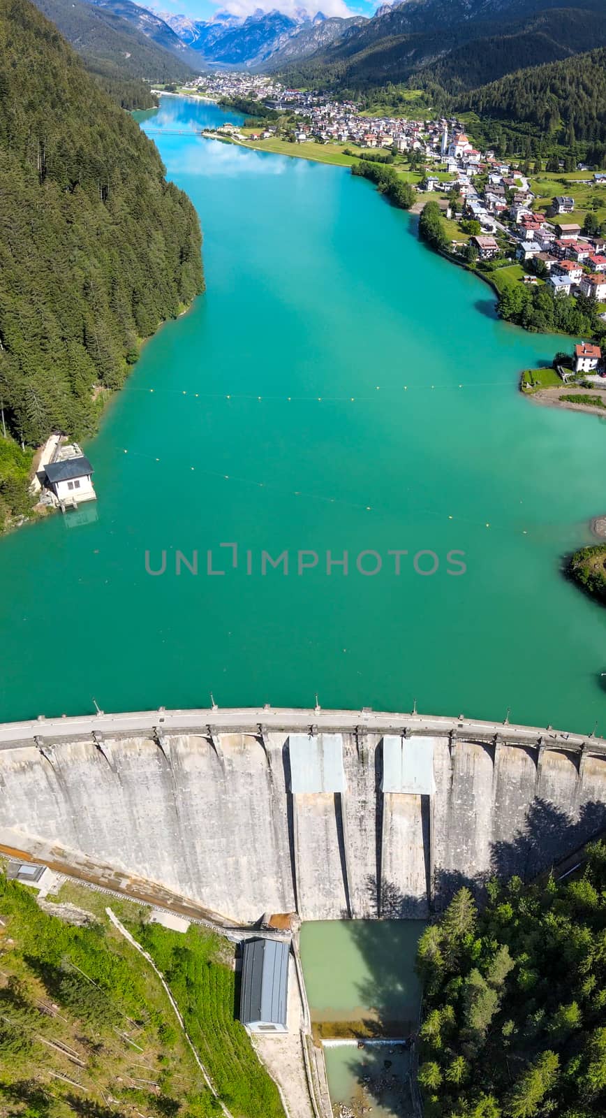 Alpin lake and dam in summertime, view from drone, Auronzo, ital by jovannig