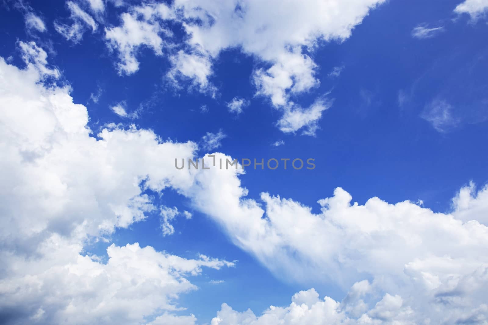 White clouds in the blue sky with background.