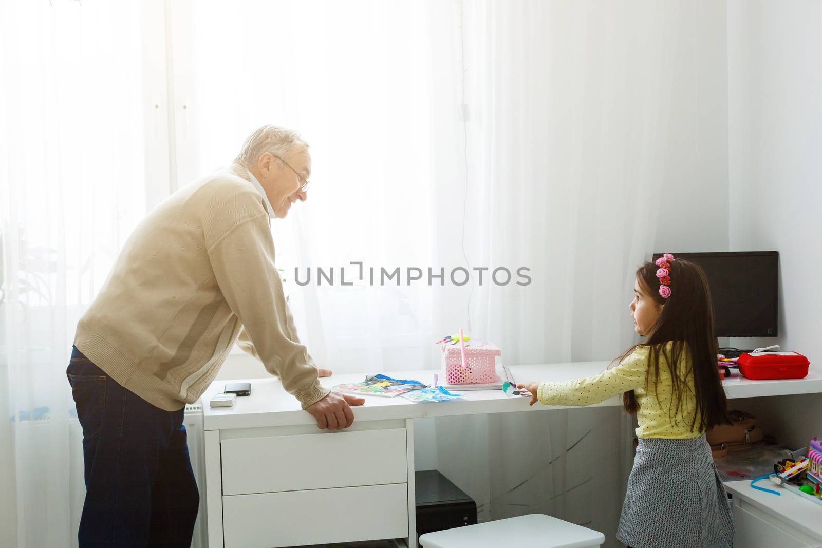 grandfather and granddaughter do her homework