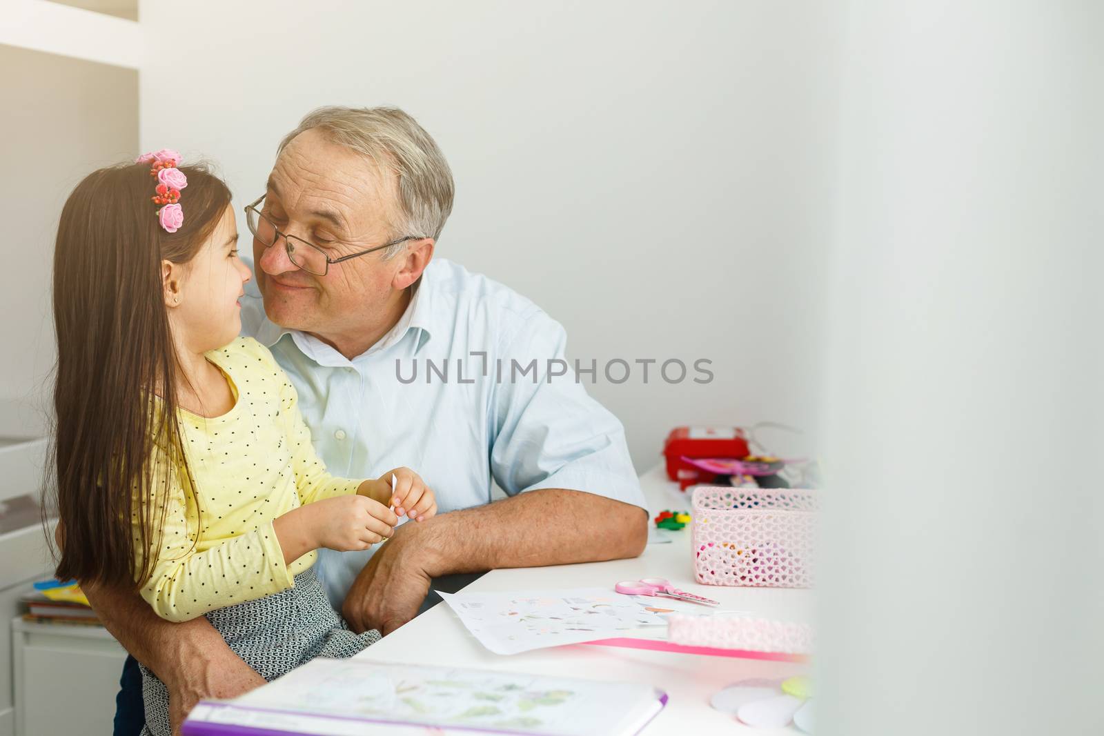 grandfather and granddaughter do her homework