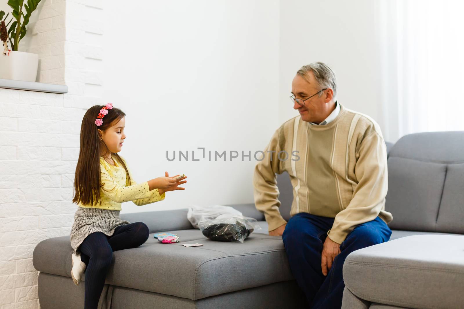 grandfather and granddaughter do her homework