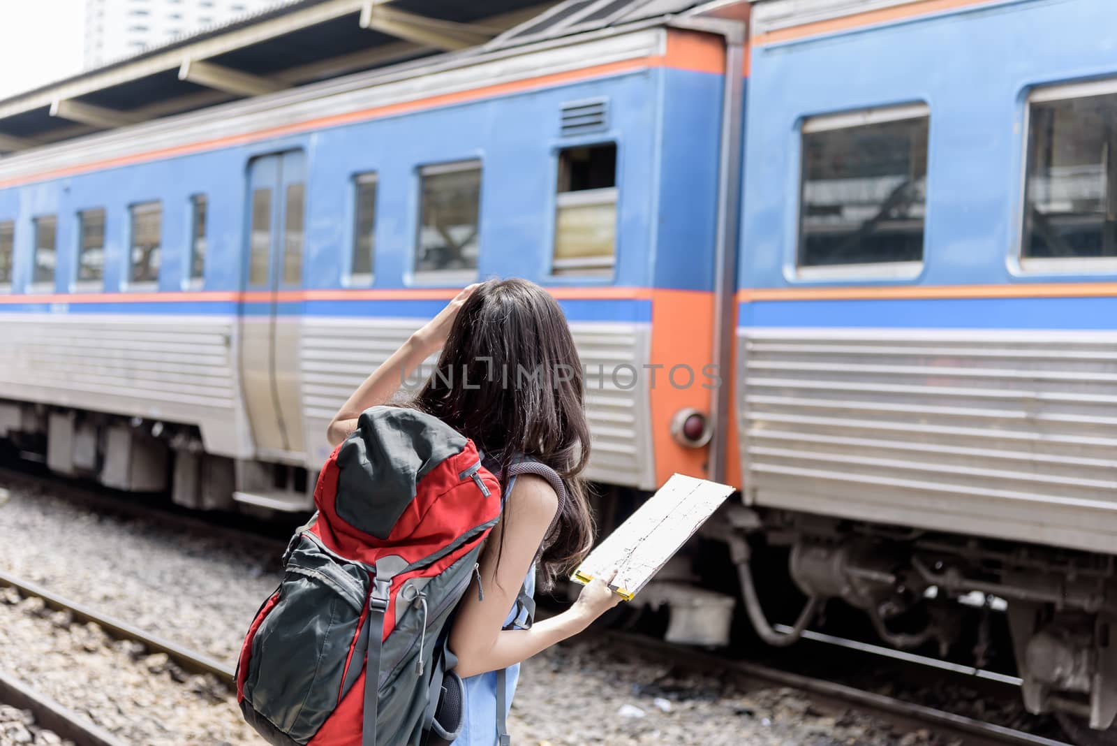 Asian woman traveler has waiting the train at Hua Lamphong stati by animagesdesign