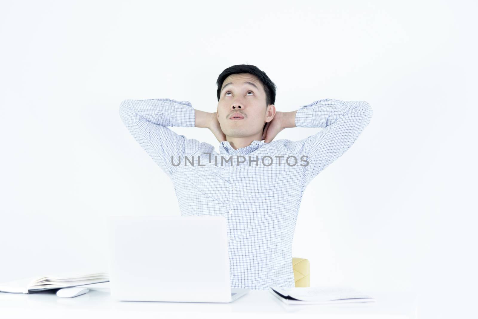 Asian employee salary man sitting at desk and working with lazy and sleepy, isolated on white background.