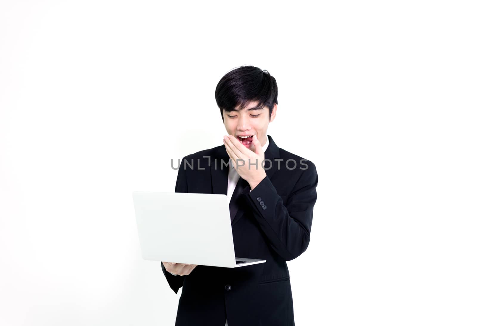 Asian business handsome man has holding laptop for woking with h by animagesdesign