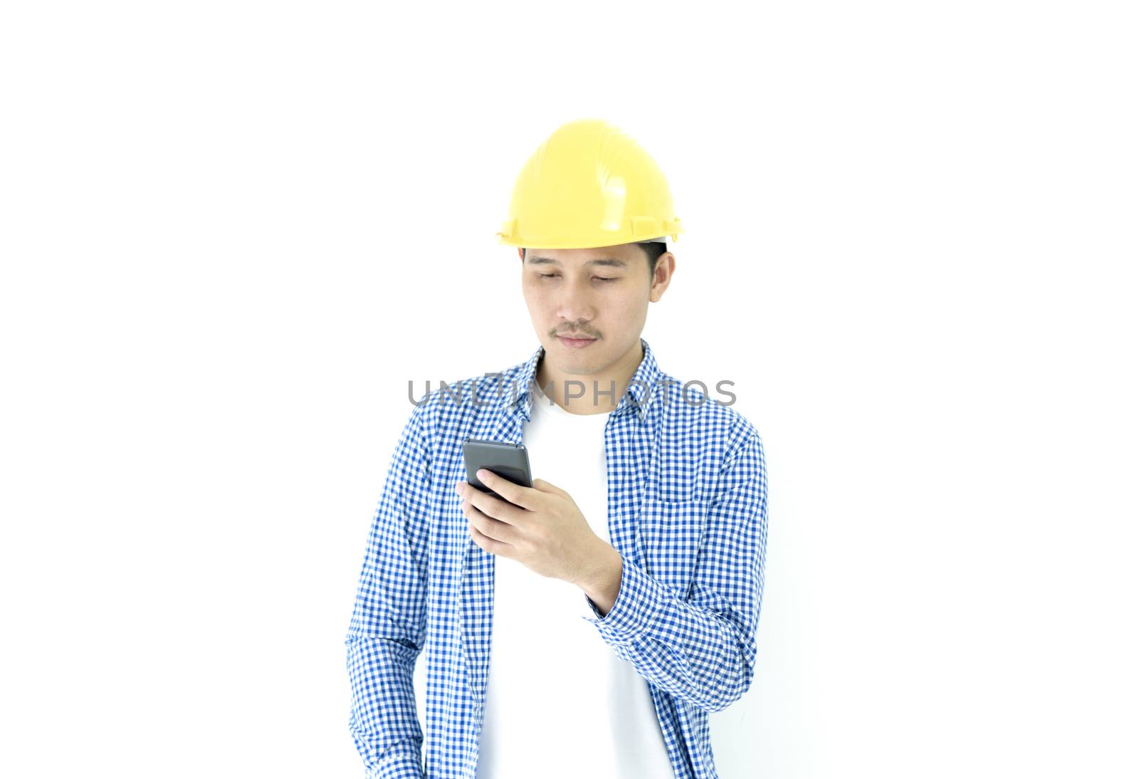 Business man engineer employee with blue scott shirt isolated has using phone on white background.