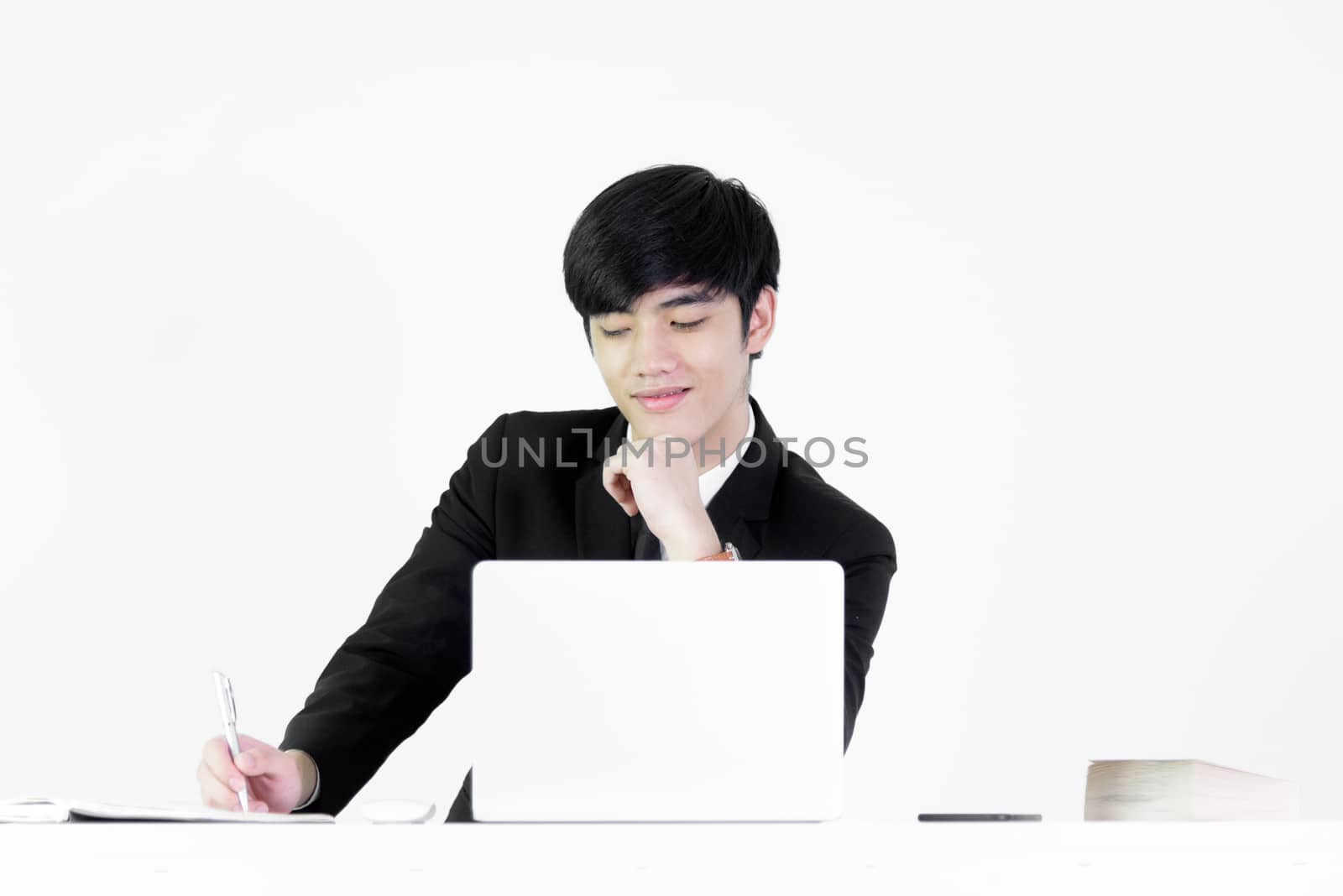 Asian manager businessman sitting at desk and working, isolated on white background.