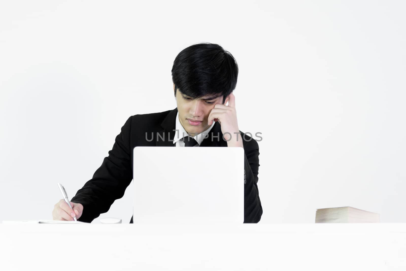 Asian manager businessman sitting at desk and working, isolated  by animagesdesign