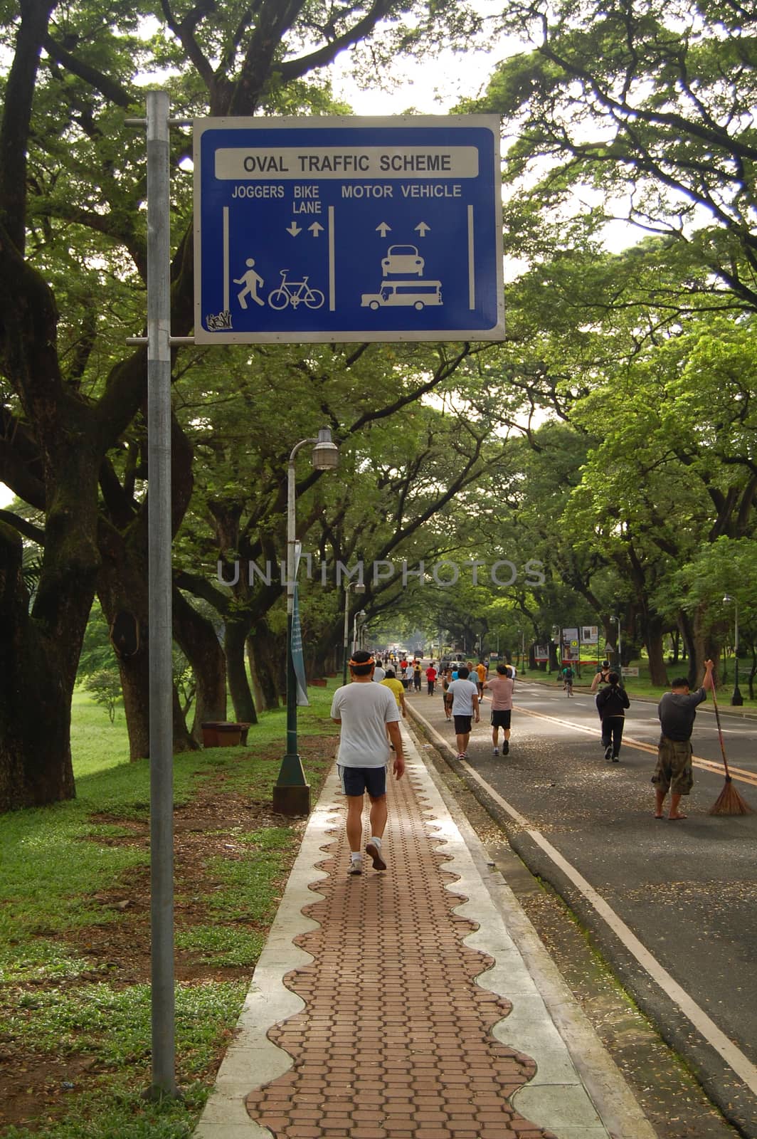 QUEZON CITY, PH - OCT. 8: Pathway and directional post at University of the Philippines on October 8, 2015 in Diliman, Quezon City, Philippines.