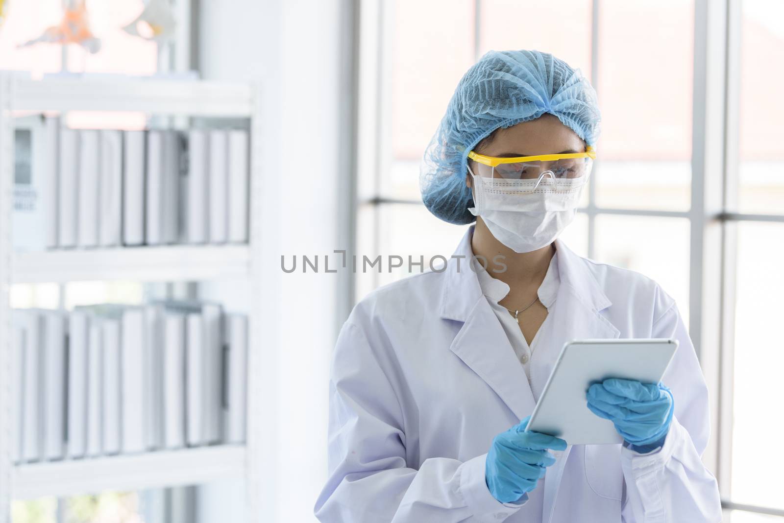 Asian young girl student scientist researching  and learning in a laboratory.