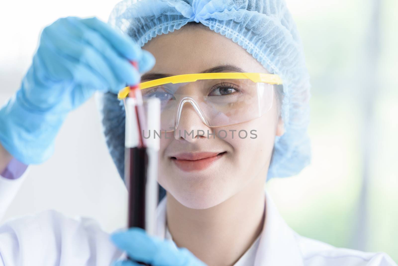 Asian young girl student scientist researching  and learning in a laboratory.